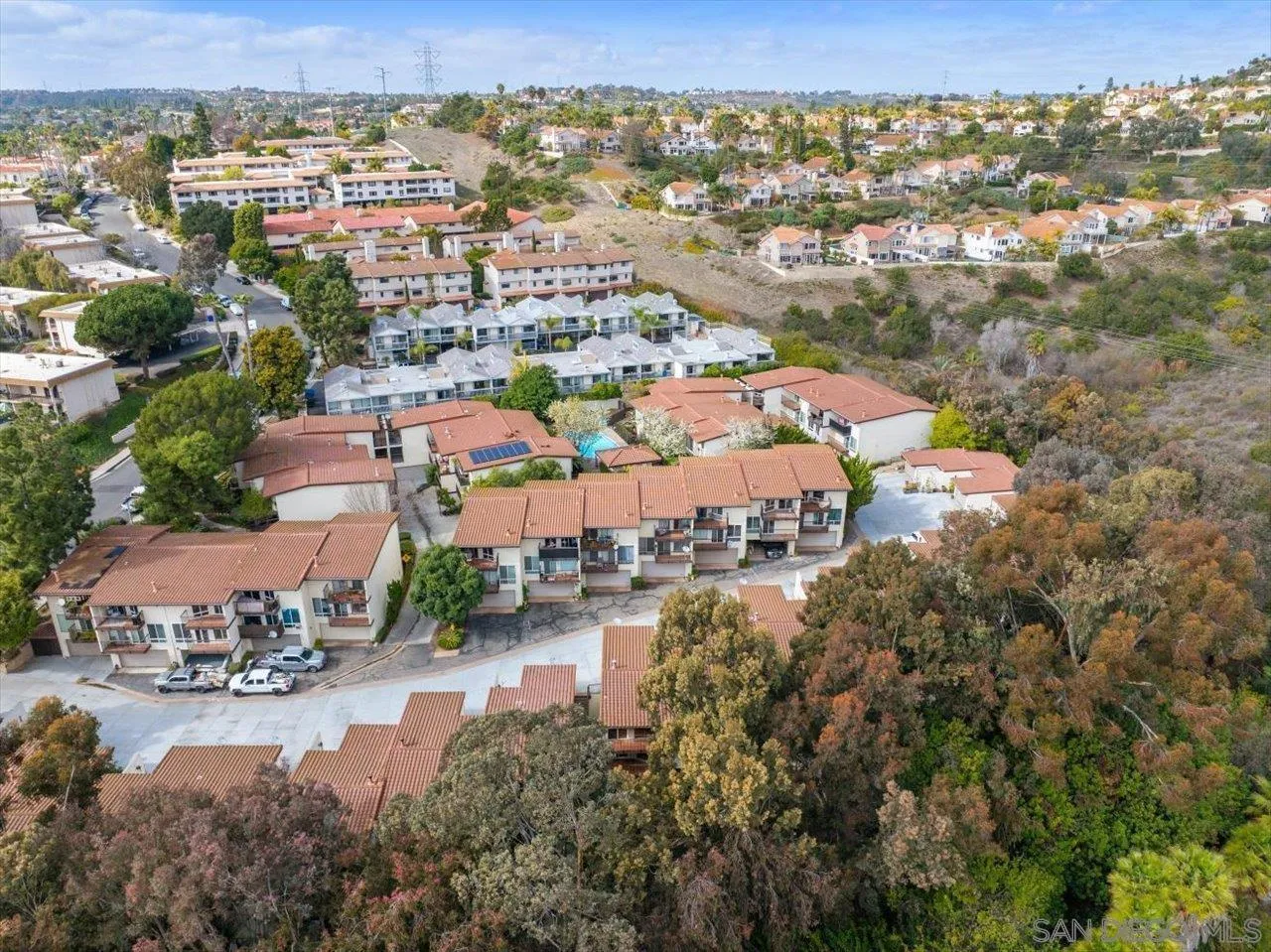 2412 Altisma Way, Unit D Carlsbad, CA 92009 - Photo 45 of 46 an aerial view of a city with lots of residential buildings ocean and mountain view in back