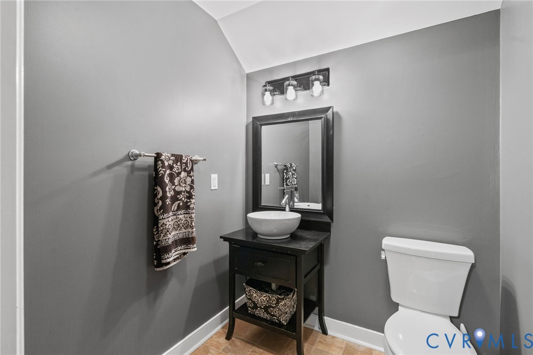 1755 Dispatch Road Quinton, VA 23141 - Photo 55 of 86 a bathroom with a toilet a sink and mirror