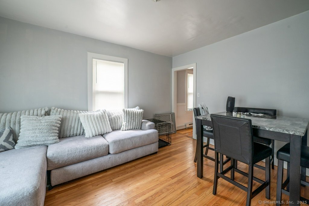 21 Poplar Street Waterbury, CT 06708 - Photo 18 of 31 a living room with furniture and a wooden floor
