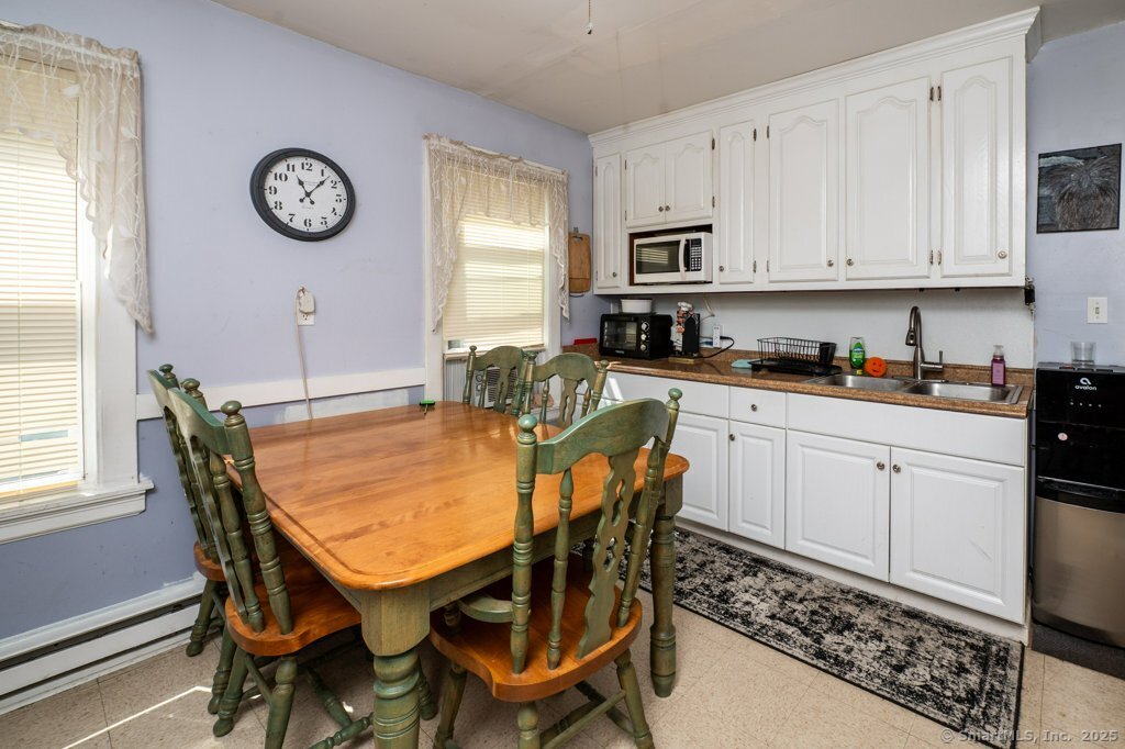21 Poplar Street Waterbury, CT 06708 - Photo 7 of 31 a view of a kitchen with granite countertop a table and chairs