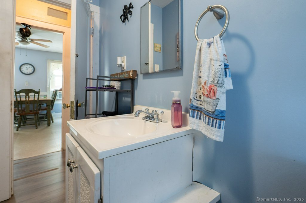 21 Poplar Street Waterbury, CT 06708 - Photo 10 of 31 a kitchen with a sink and a stove