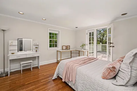a bedroom with a bed and a table