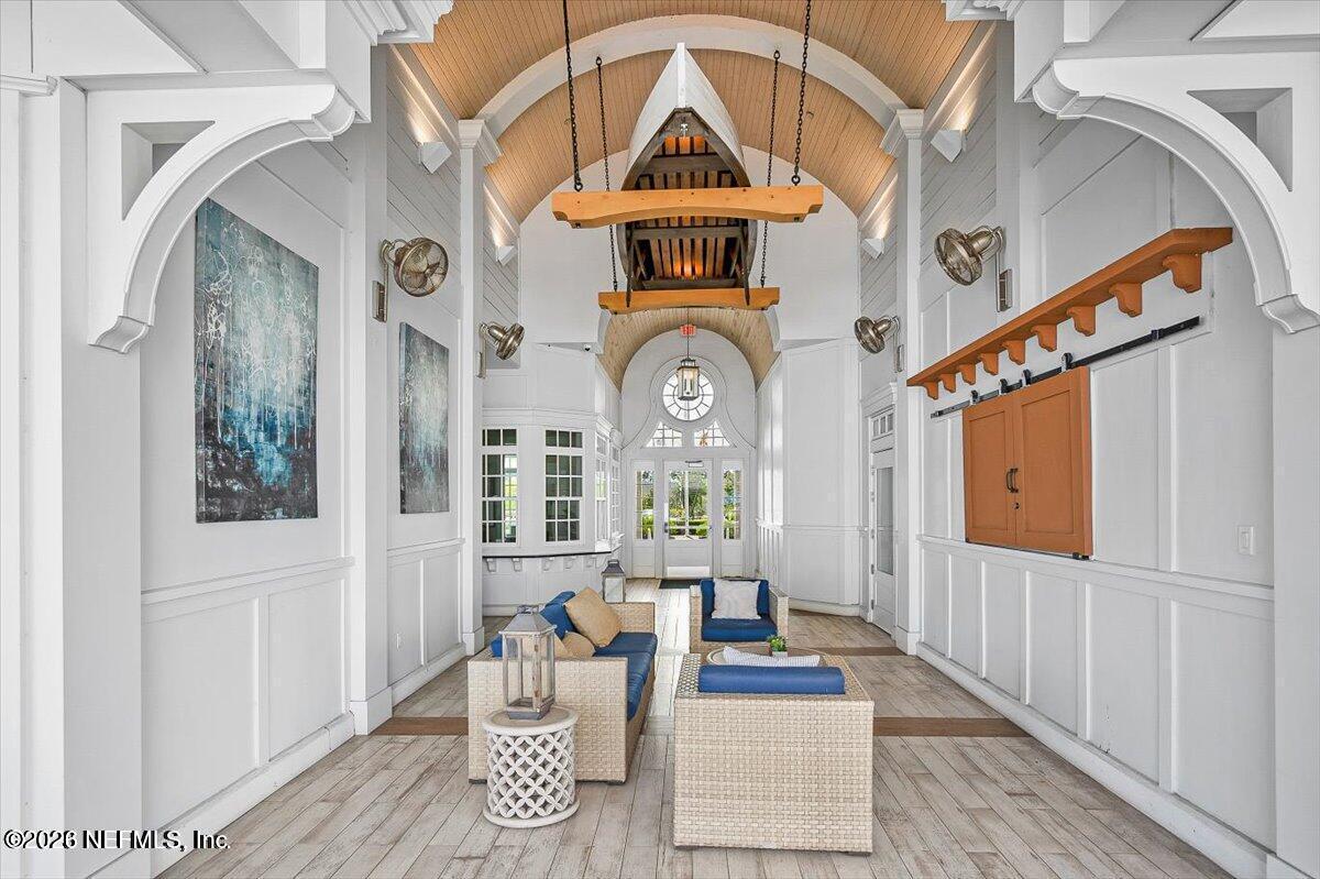 197 Charlie Way St. Augustine, FL 32095 - Photo 28 of 37 a living room with furniture and a clock