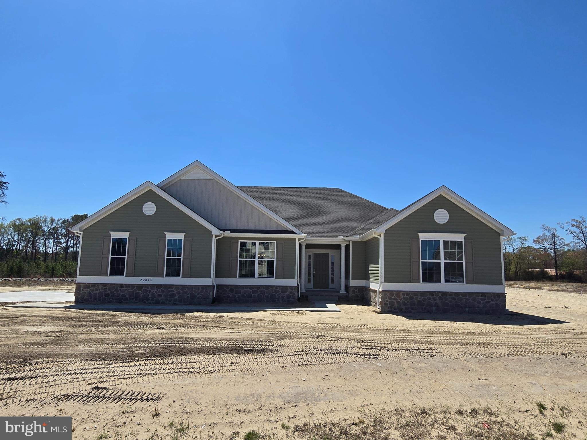 1 William Street Georgetown, DE 19947 - Photo 2 of 34 a front view of a house with a garden and yard