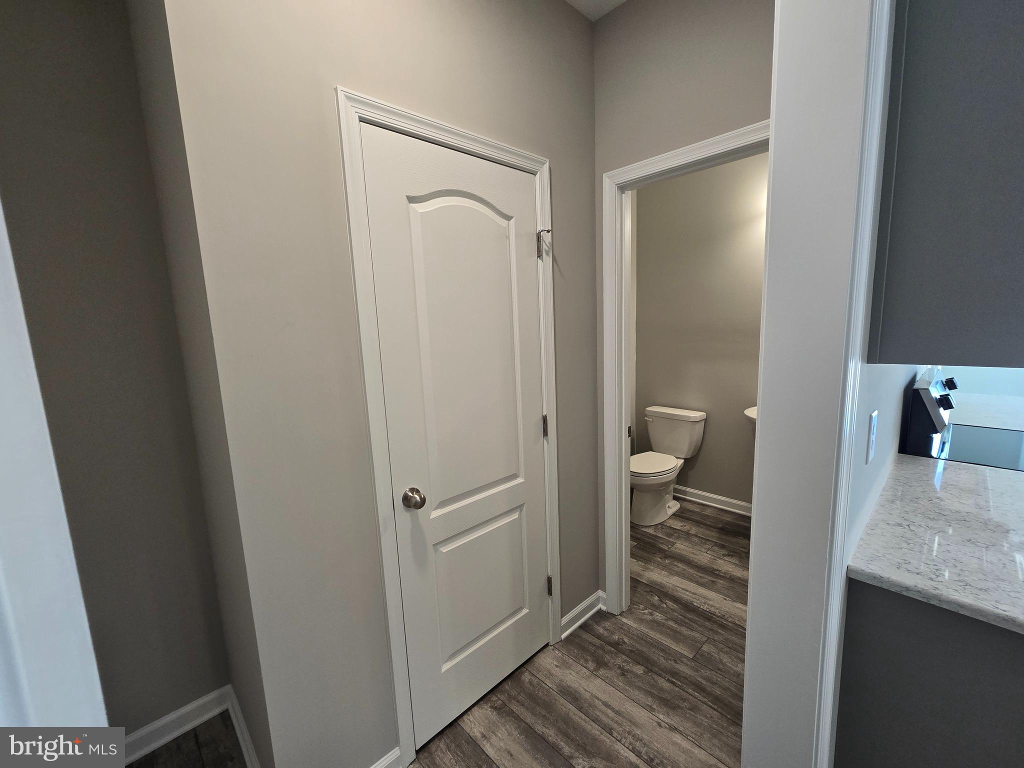 1 William Street Georgetown, DE 19947 - Photo 26 of 34 a bathroom with a granite countertop sink a toilet and a shower