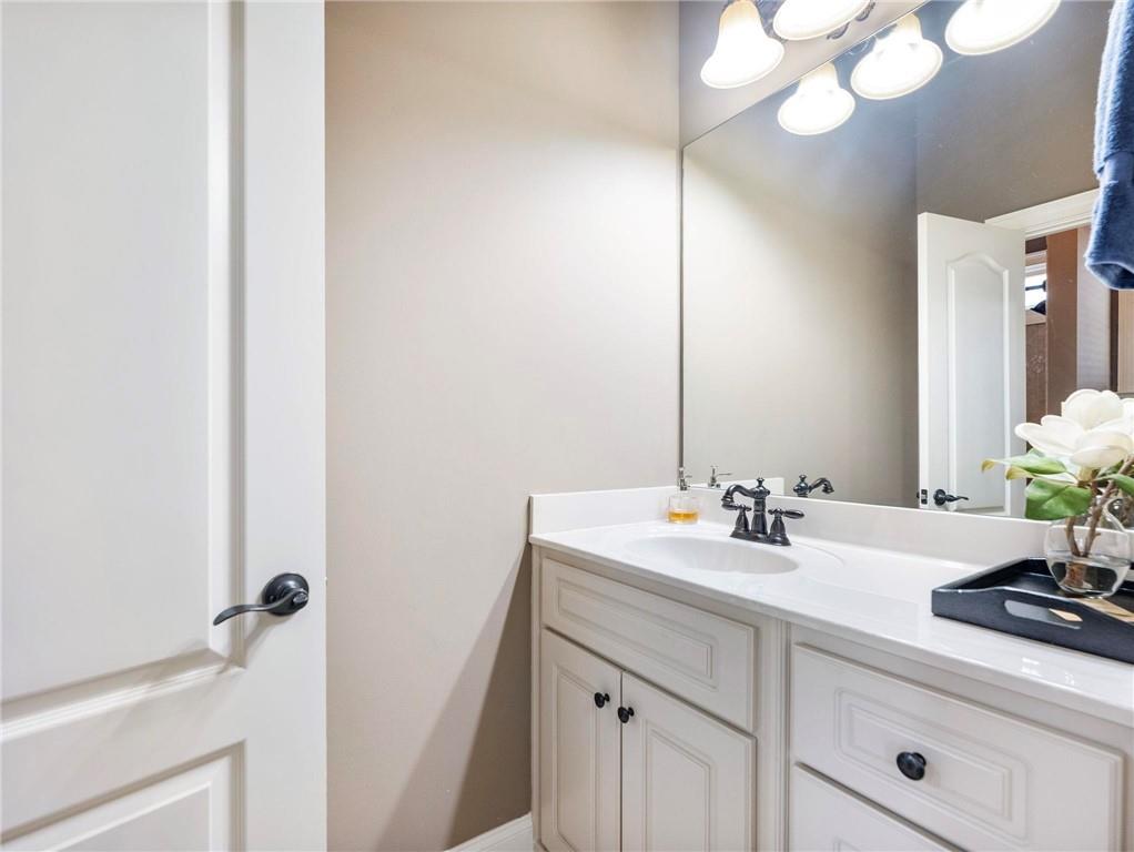 6147 Golf View Court Jefferson, GA 30549 - Photo 35 of 73 a bathroom with a sink and a mirror