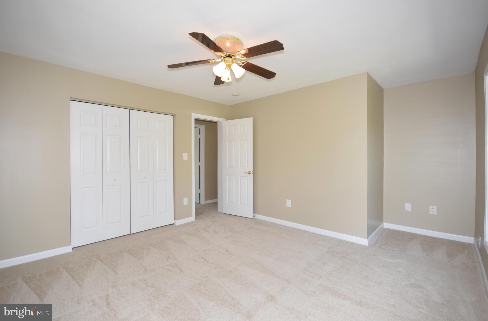 150 High Bluff Road Middletown, VA 22645 - Photo 17 of 30 a view of an empty room with a ceiling fan