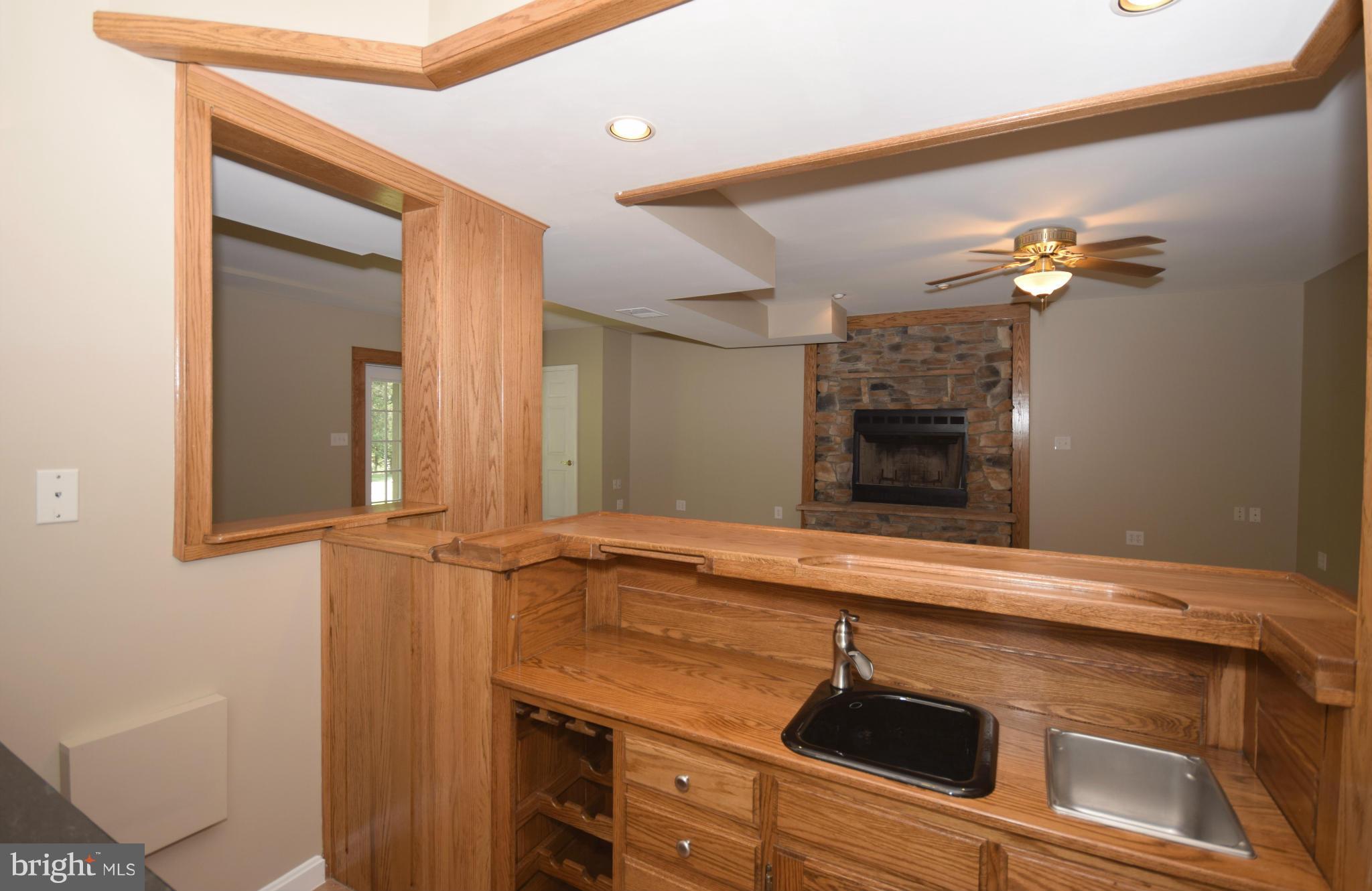 150 High Bluff Road Middletown, VA 22645 - Photo 26 of 30 a view of a hallway with a sink and a chandelier