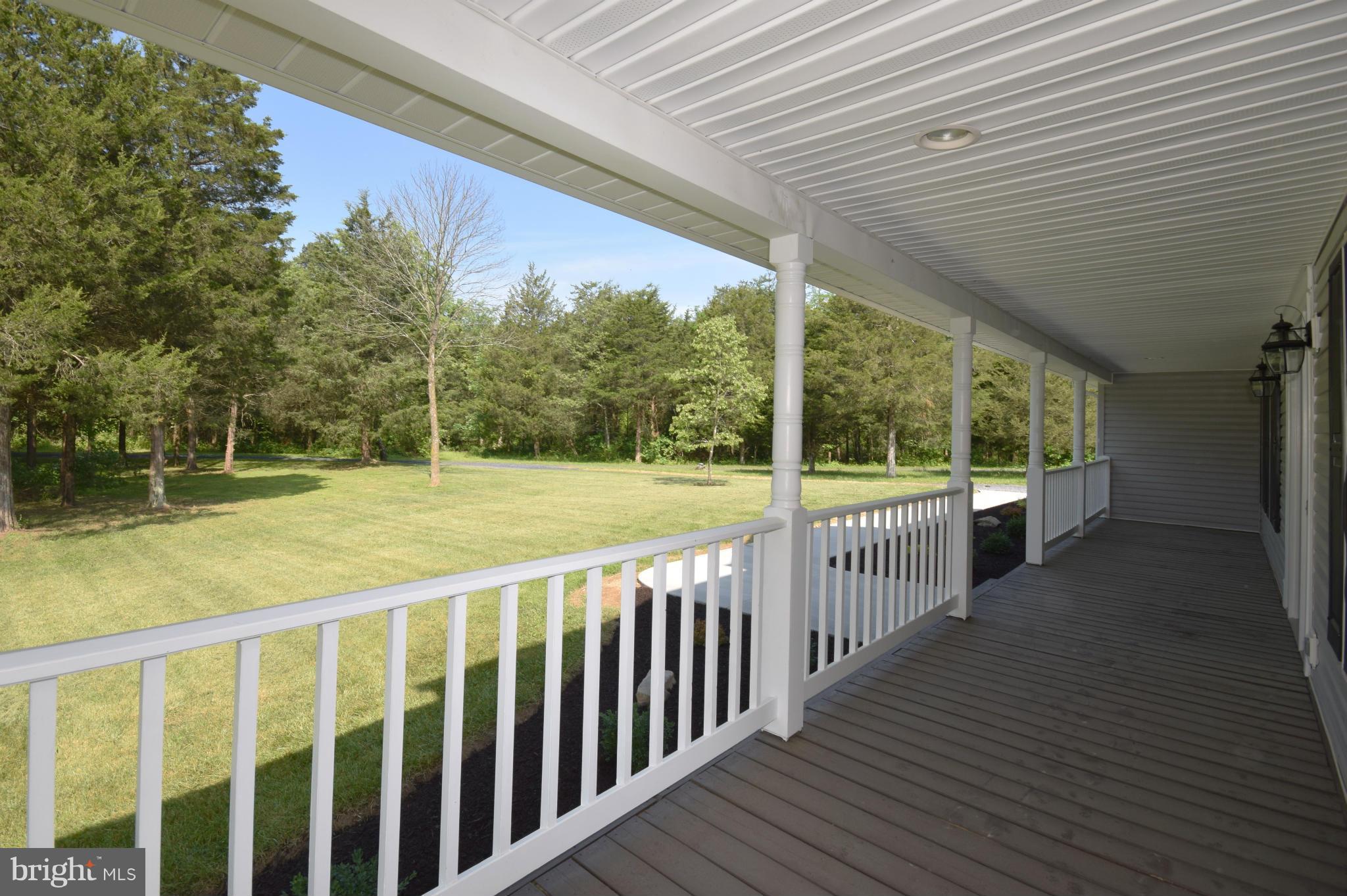 150 High Bluff Road Middletown, VA 22645 - Photo 4 of 30 a view of a room with wooden floor and fence