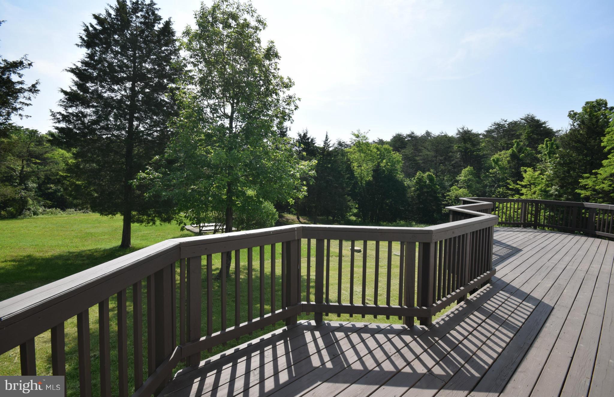 150 High Bluff Road Middletown, VA 22645 - Photo 5 of 30 a balcony with wooden floor and fence
