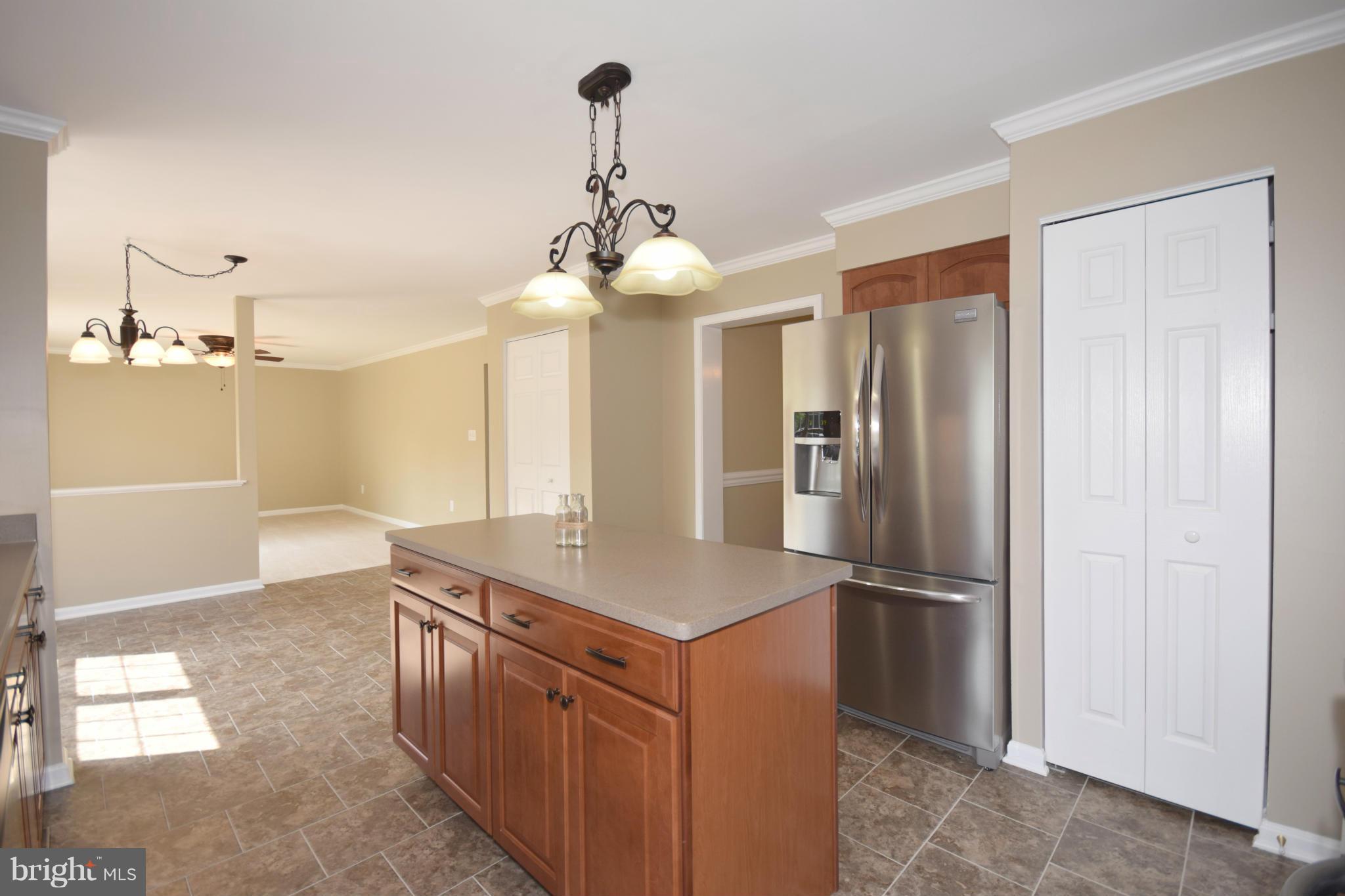 150 High Bluff Road Middletown, VA 22645 - Photo 9 of 30 a kitchen with stainless steel appliances granite countertop a refrigerator a sink and a stove