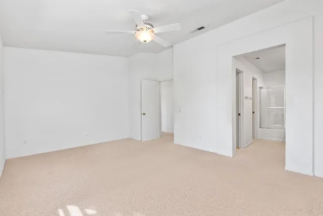 a bathroom with a double vanity sink mirror and shower