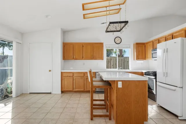 a view of a kitchen with furniture and window