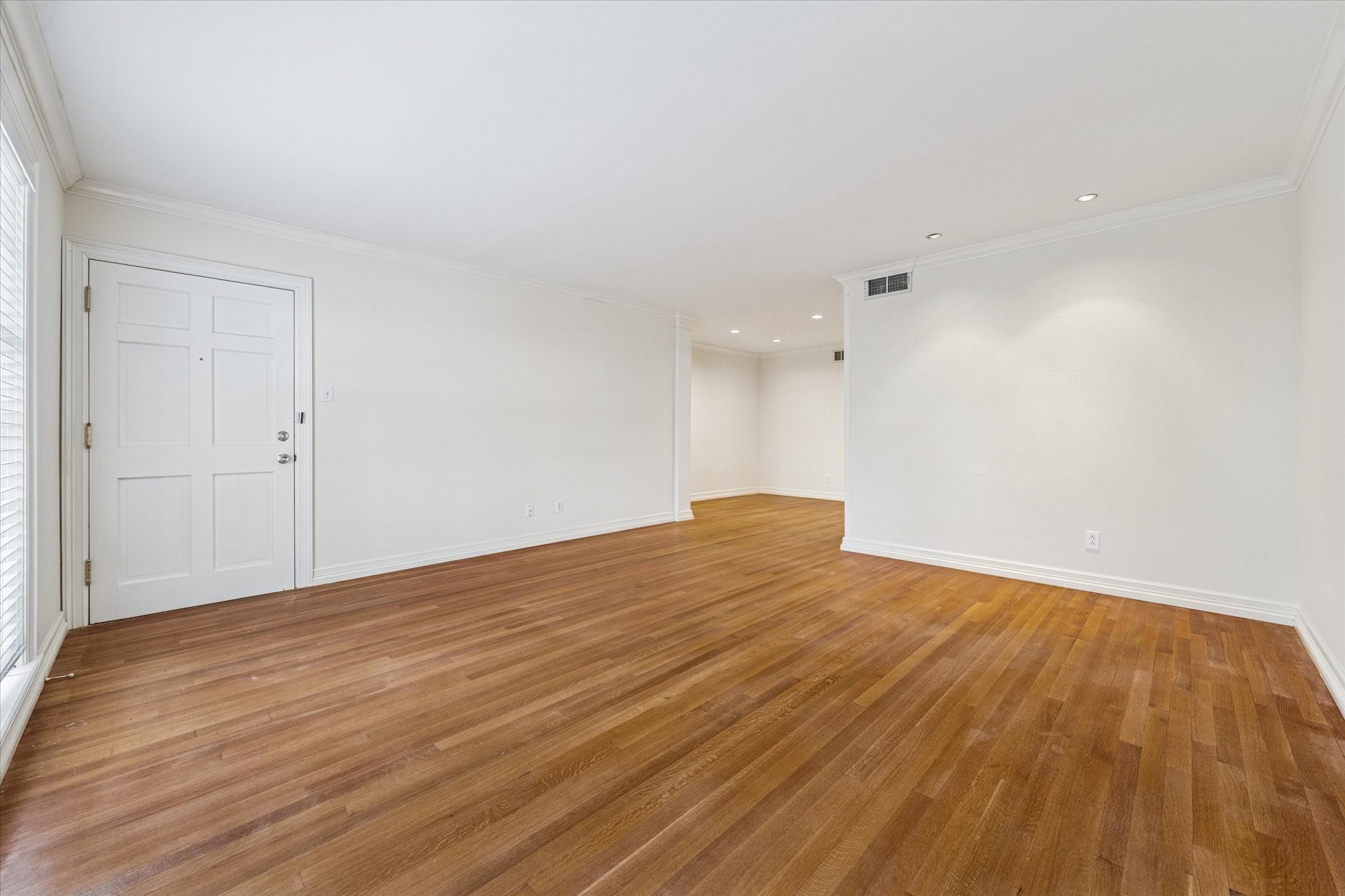 453 North Post Oak Lane Houston, TX 77024 - Photo 3 of 18 a view of empty room with wooden floor and fan