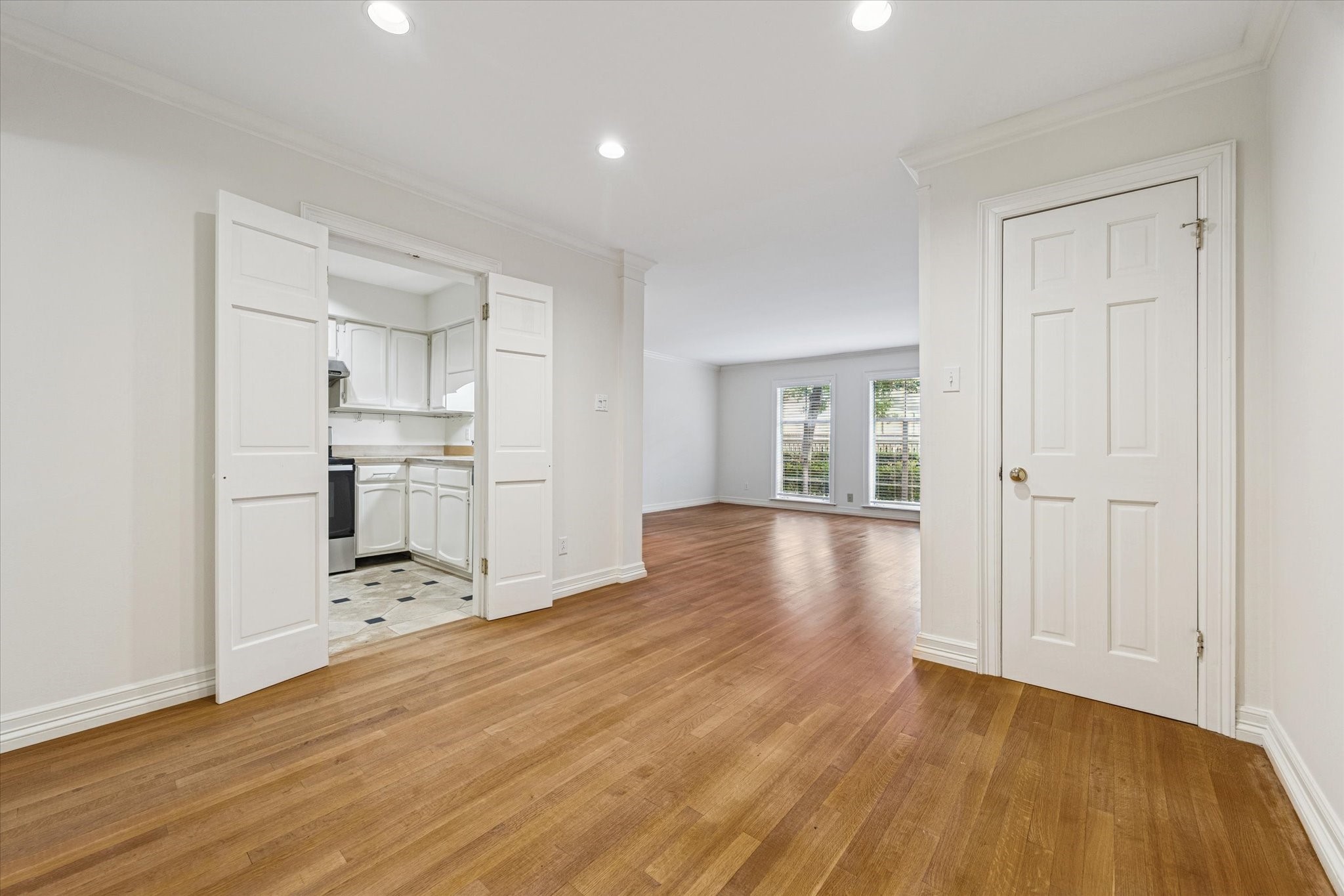 453 North Post Oak Lane Houston, TX 77024 - Photo 4 of 18 a view of a kitchen with wooden floor and a refrigerator