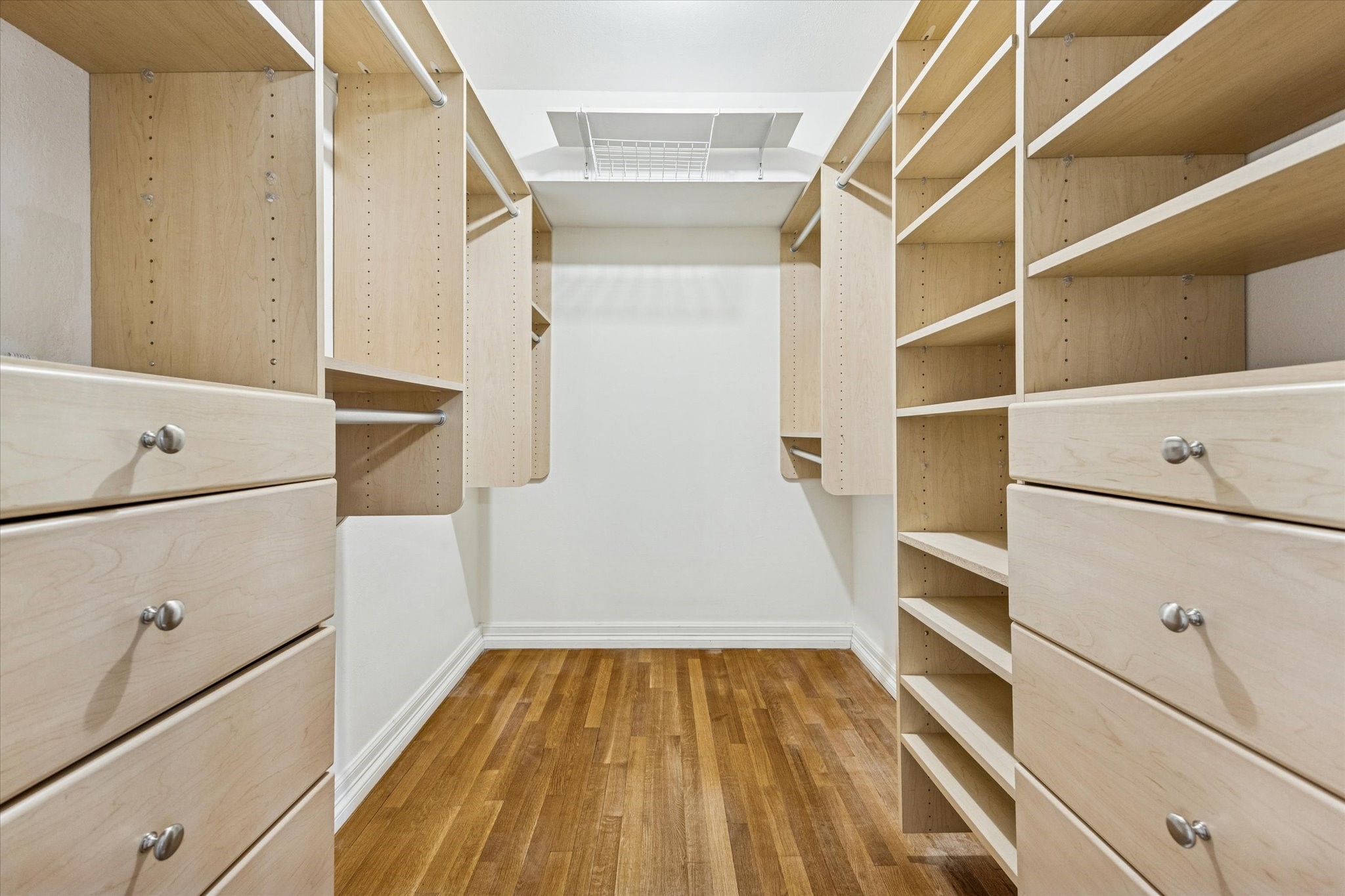 453 North Post Oak Lane Houston, TX 77024 - Photo 10 of 18 a view of walk in closet with empty racks