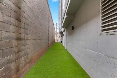 a view of a pathway with a yard
