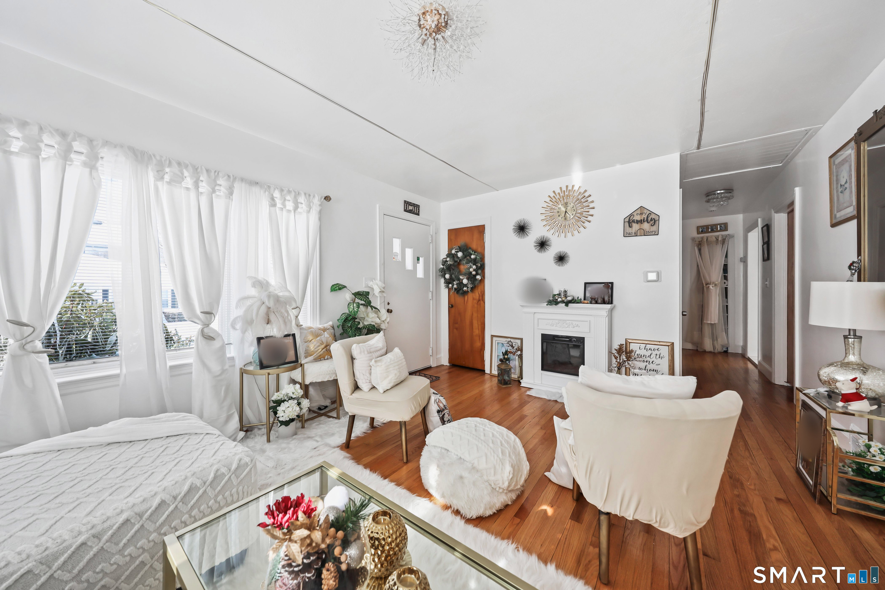 17 Rosedale Avenue Waterbury, CT 06705 - Photo 3 of 20 a living room with furniture fireplace and a large window