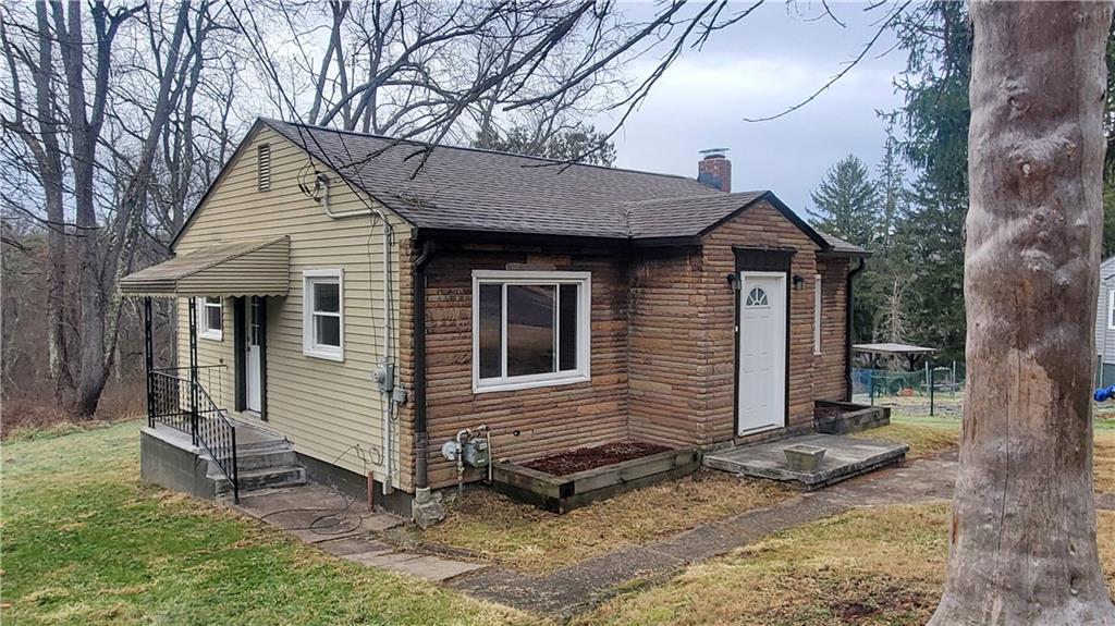 125 Michael Road Cheswick, PA 15024 - Photo 3 of 14 a view of a house with a yard