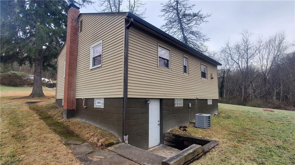 125 Michael Road Cheswick, PA 15024 - Photo 4 of 14 a front view of a house with barbeque area
