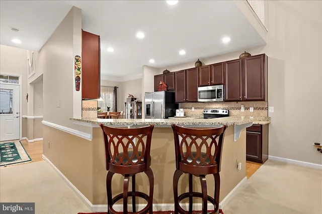 a kitchen with a refrigerator sink and microwave
