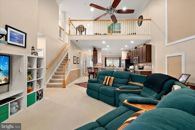 a view of a a dining room with furniture window and wooden floor