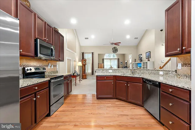 a view of a dining room with furniture and a window