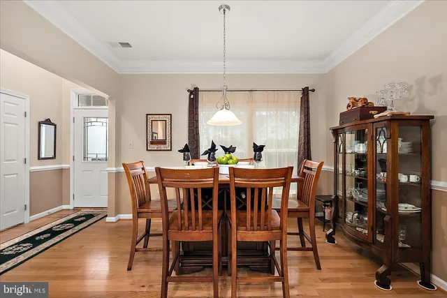 a kitchen with stainless steel appliances granite countertop a refrigerator stove and sink