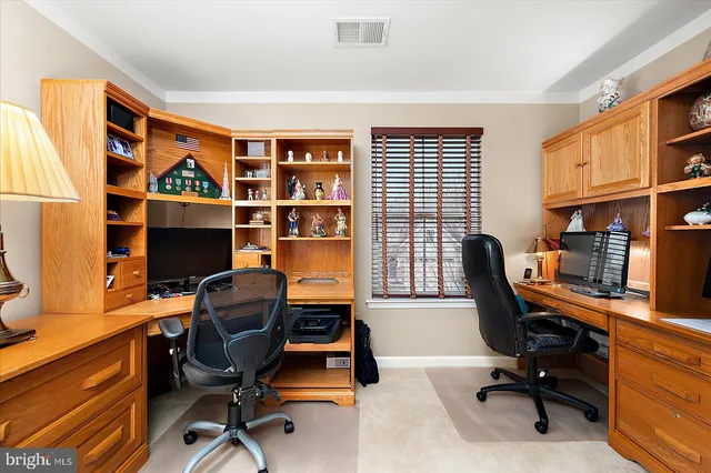 a view of a swimming pool and outdoor seating