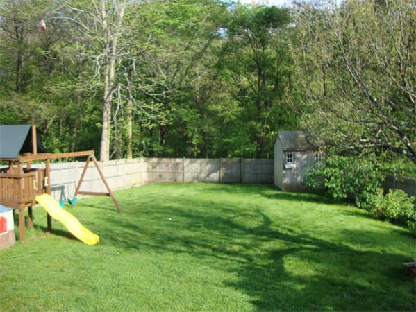 59 Felch Road Natick, MA 01760 - Photo 3 of 13 a view of a backyard with a slide
