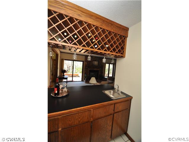 3904 Timber Ridge Road Midlothian, VA 23112 - Photo 3 of 12 a kitchen with a sink and cabinets