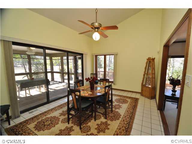 3904 Timber Ridge Road Midlothian, VA 23112 - Photo 4 of 12 a view of a dining room with furniture and a chandelier