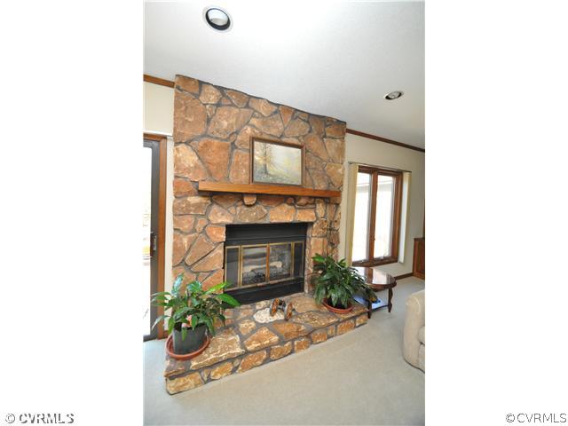 3904 Timber Ridge Road Midlothian, VA 23112 - Photo 6 of 12 a living room with furniture and a fireplace