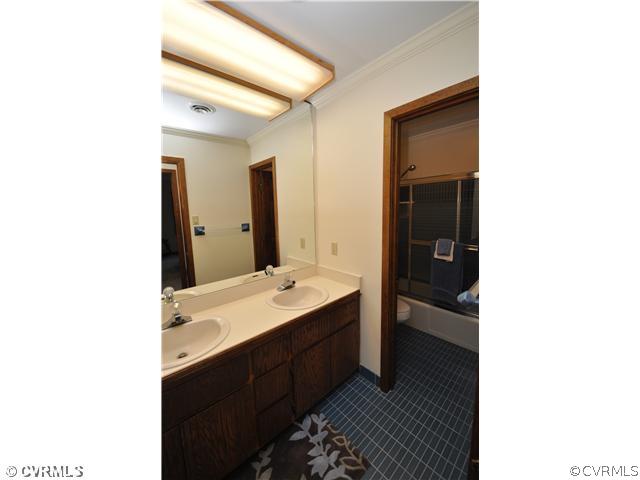 3904 Timber Ridge Road Midlothian, VA 23112 - Photo 8 of 12 a en suite bathroom with a sink and mirror