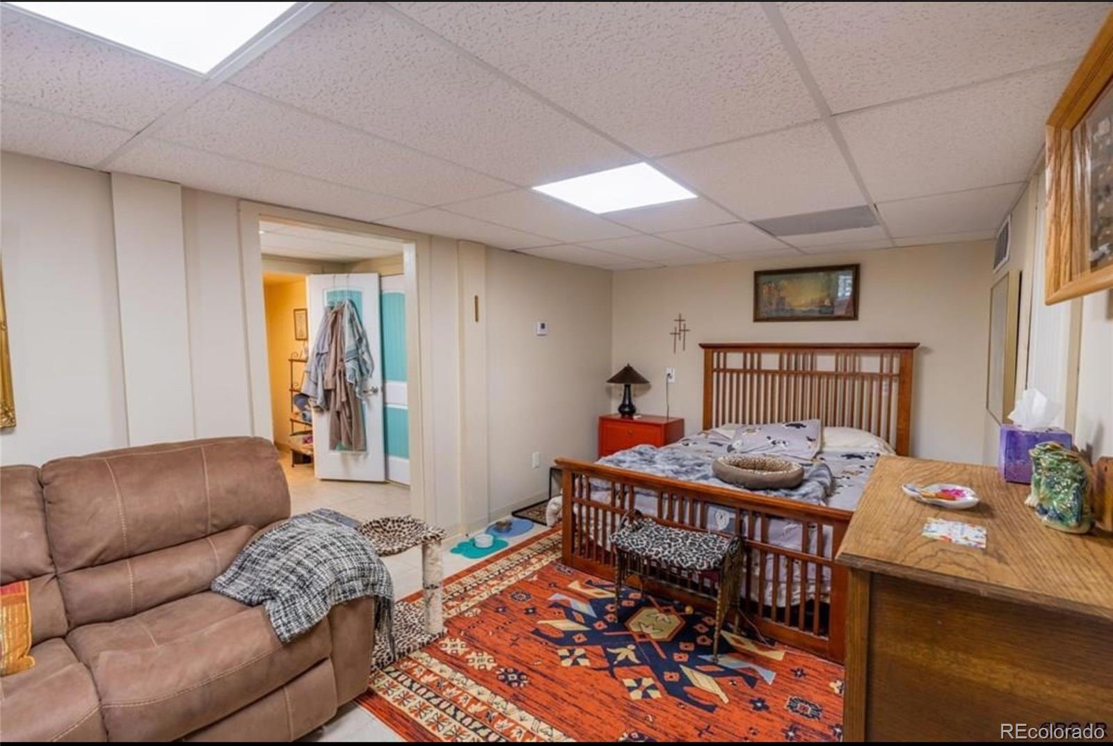 7878 Copper Gulch Road Cotopaxi, CO 81223 - Photo 11 of 17 a living room with furniture a rug and a window