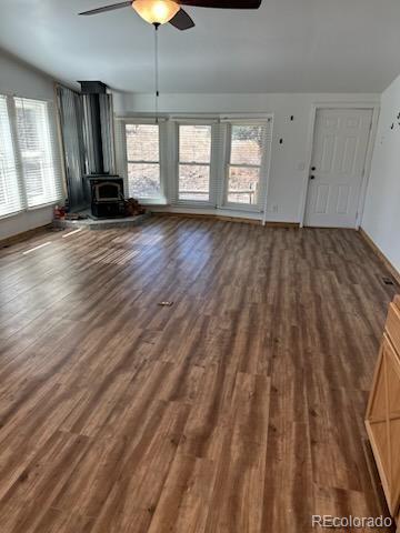 7878 Copper Gulch Road Cotopaxi, CO 81223 - Photo 13 of 17 a view of an empty room with window and wooden floor