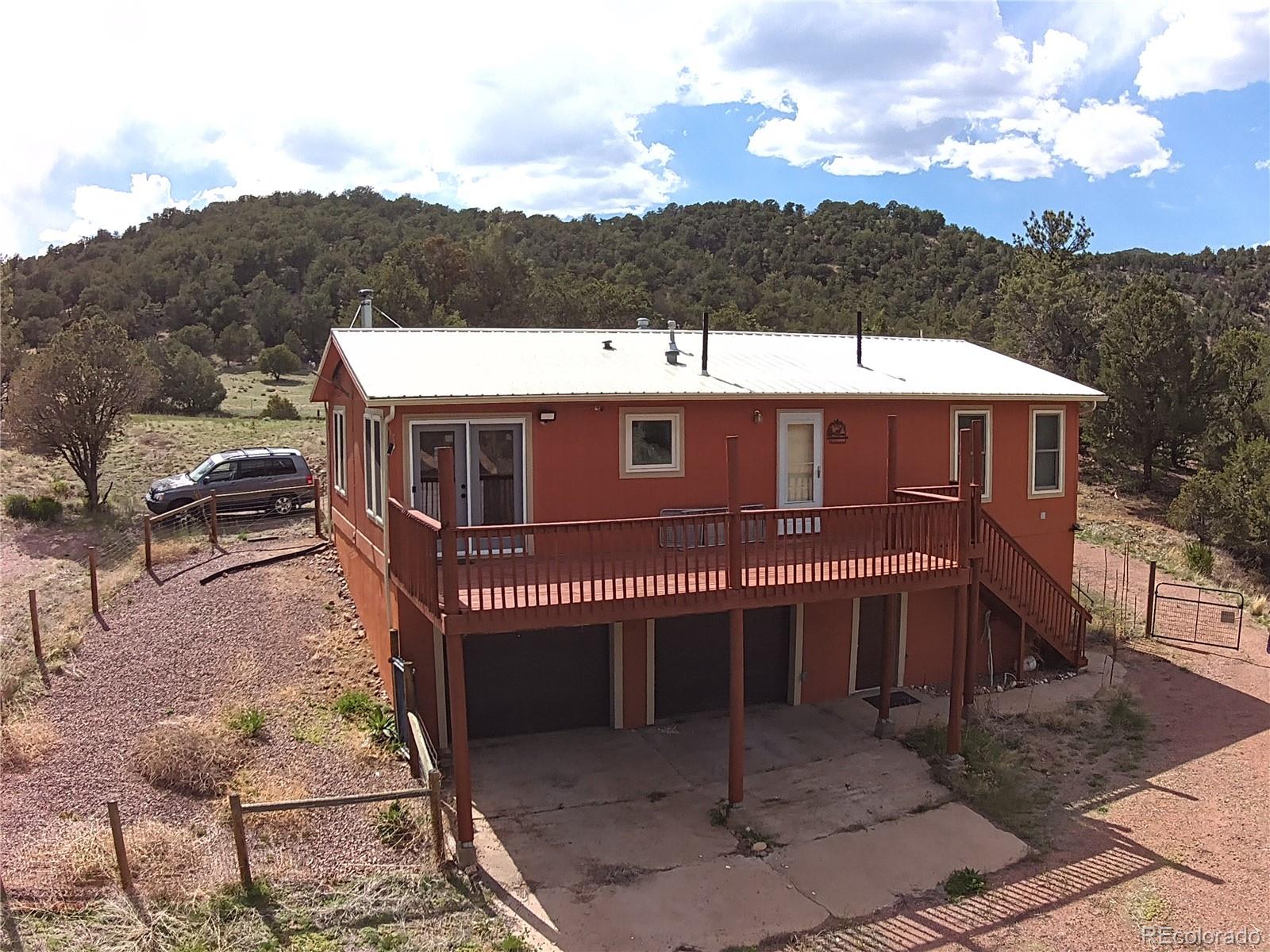 7878 Copper Gulch Road Cotopaxi, CO 81223 - Photo 2 of 17 a view of a house with a yard