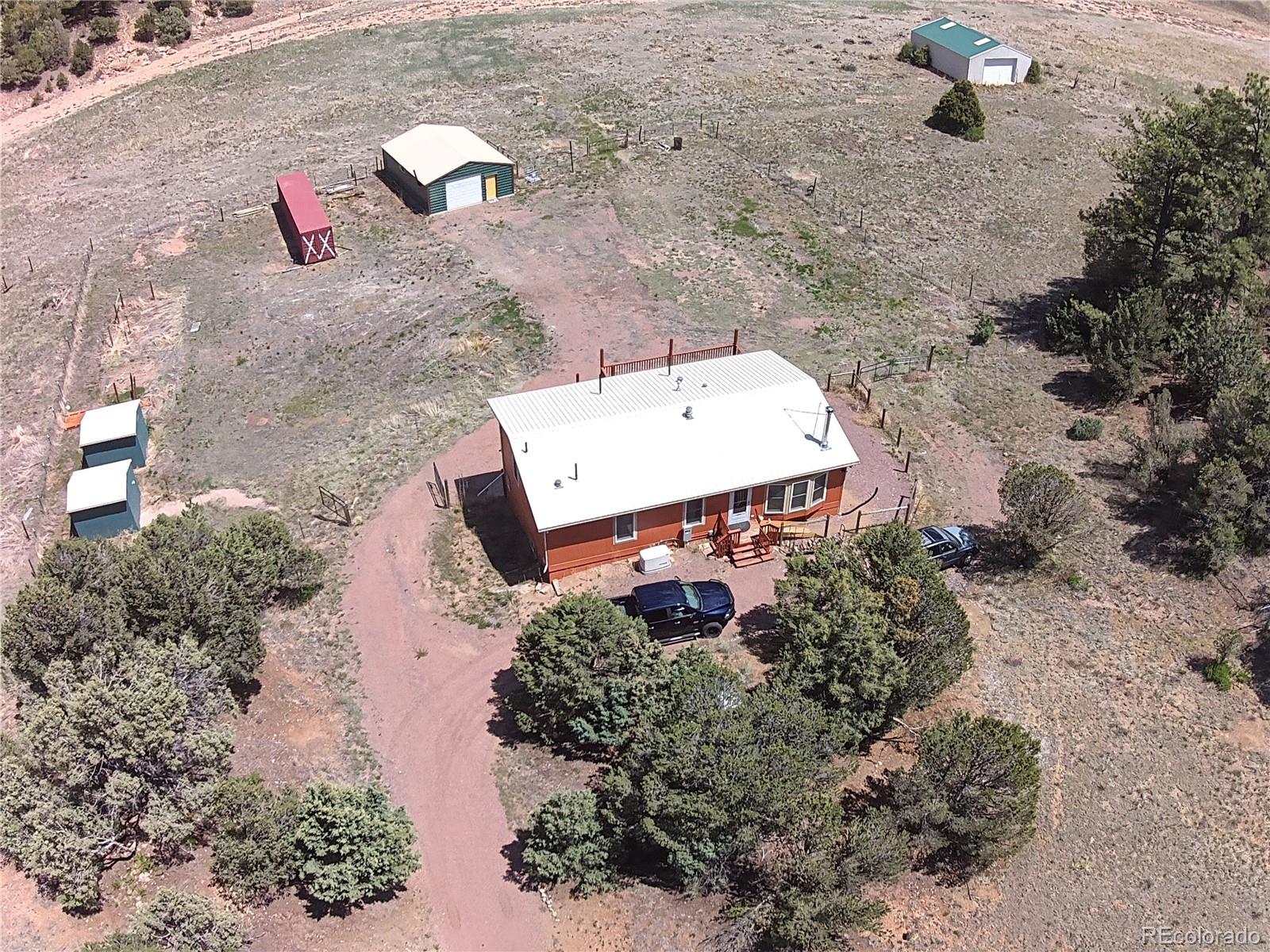7878 Copper Gulch Road Cotopaxi, CO 81223 - Photo 3 of 17 an aerial view of a house with a yard