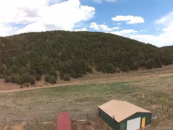 a view of a yard with a mountain