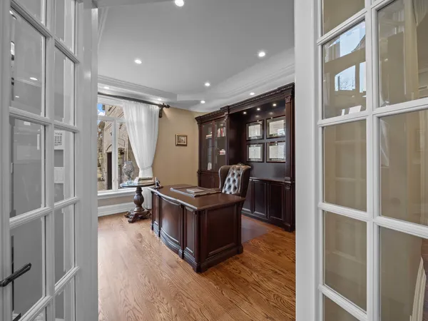 a large kitchen with stainless steel appliances kitchen island granite countertop a large counter top and a stove