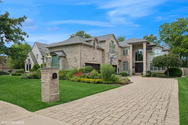 a view of a large garden with a building in the background