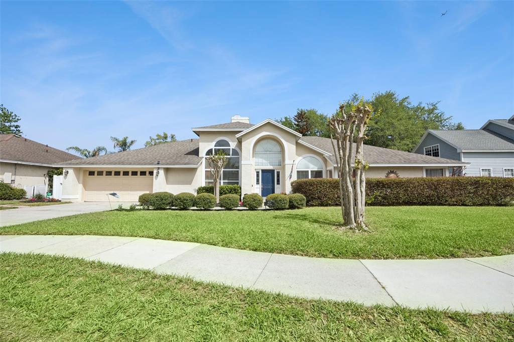 4227 Pecan Lane Orlando, FL 32812 - Photo 1 of 1 a view of a house with a big yard plants and palm trees