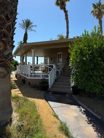 a front view of a house with swimming pool