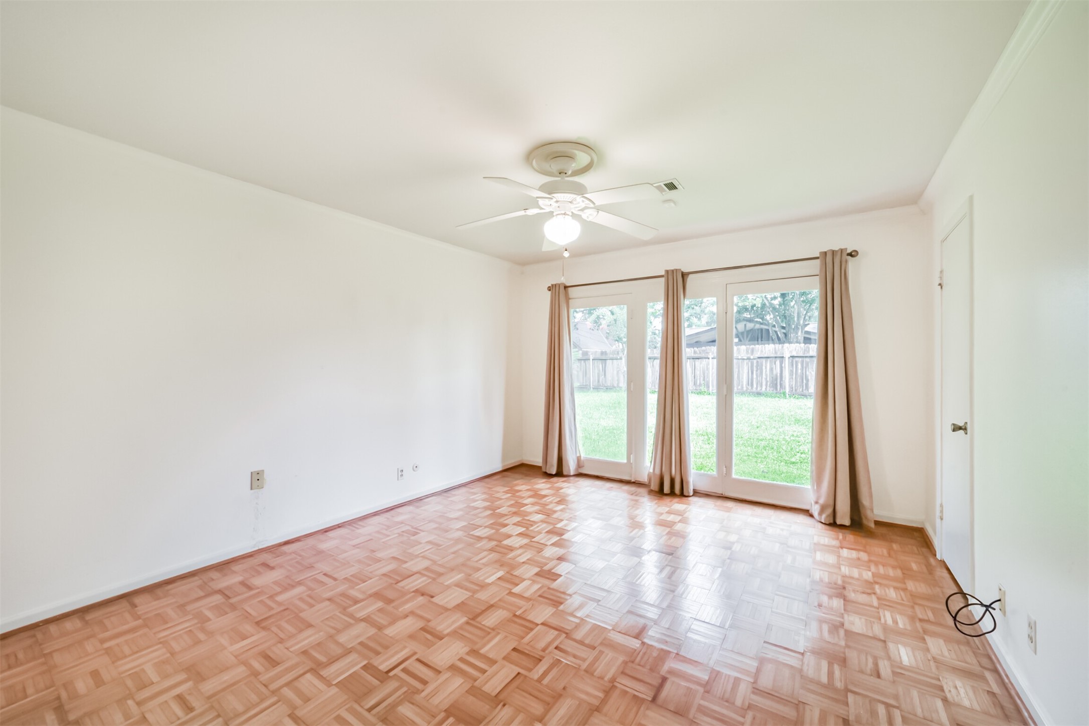 7510 Romney Road Houston, TX 77036 - Photo 22 of 32 Primary bedroom with a view and access to the backyard. How amazing!