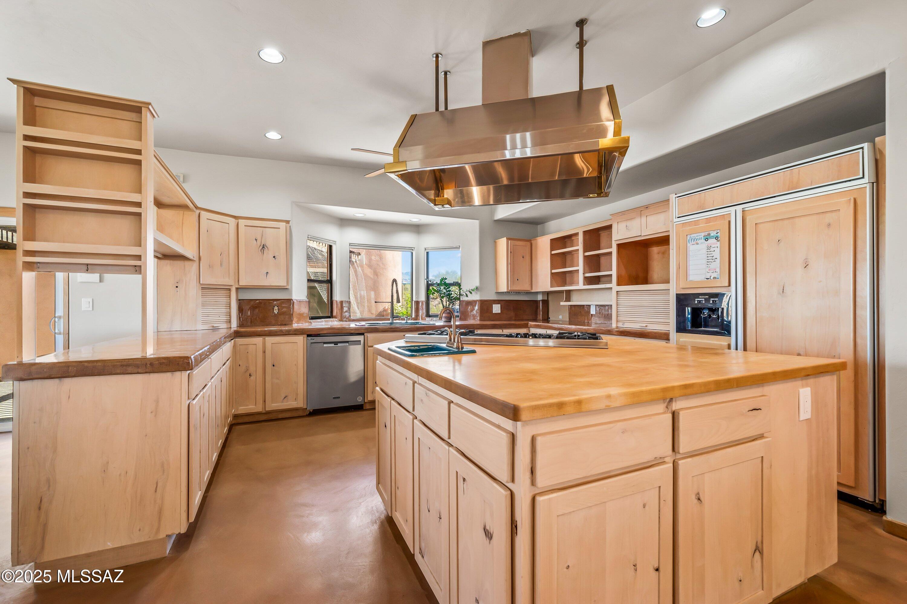 30 West Stone Loop Tucson, AZ 85704 - Photo 15 of 26 a kitchen with counter top space and stainless steel appliances