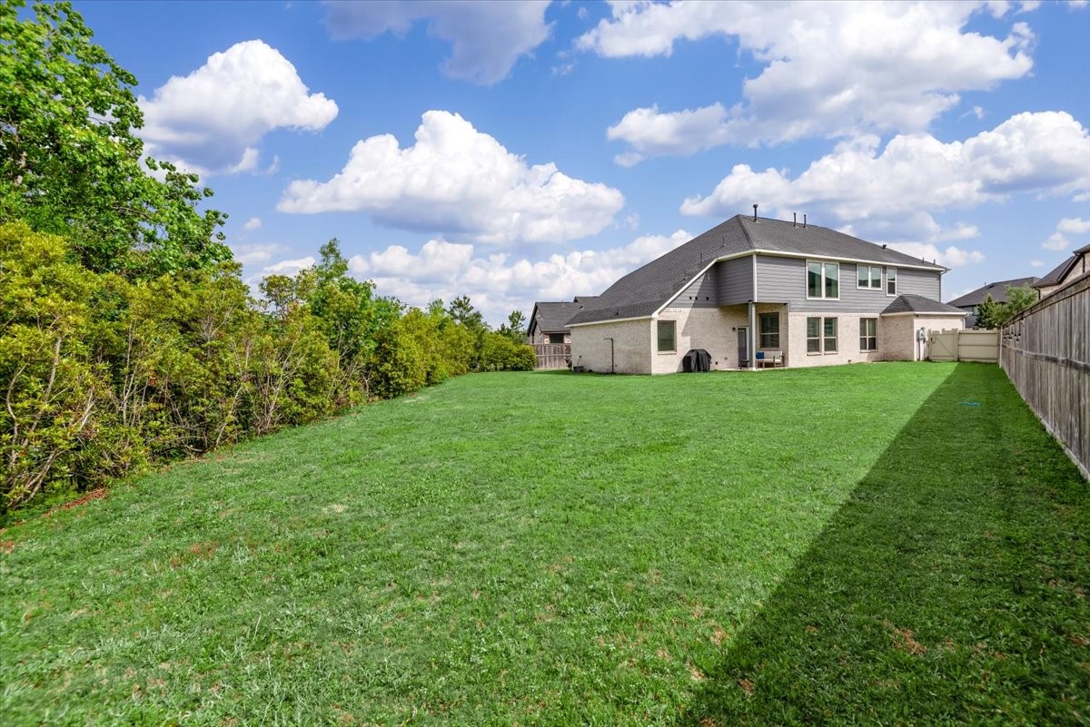 17814 Tree Of Heaven Conroe, TX 77385 - Photo 10 of 48 Expansive oversized backyard backing to a protected natural reserve—offering privacy, serene views, and no rear neighbors.