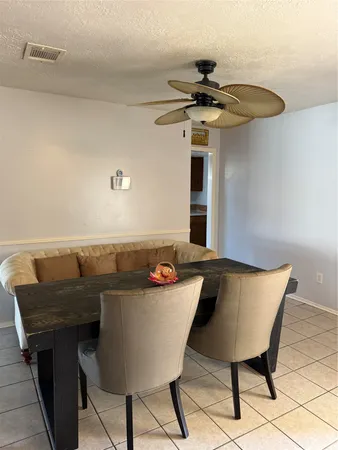 a view of a table and chairs in a kitchen