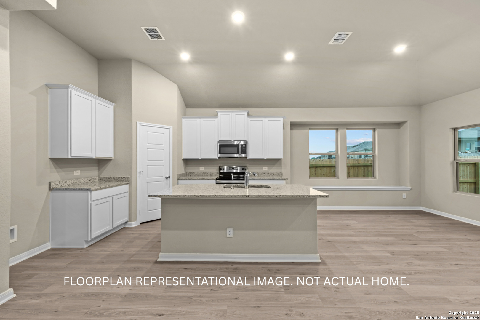 1164 Limestone Ridge Seguin, TX 78155 - Photo 20 of 45 a large kitchen with granite countertop a stove top oven a sink a counter space and cabinets