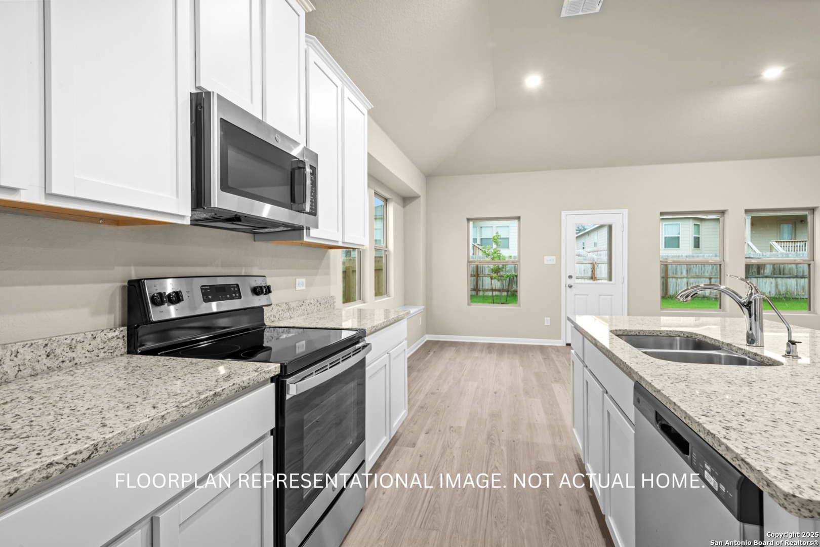 1164 Limestone Ridge Seguin, TX 78155 - Photo 22 of 45 a kitchen with stainless steel appliances granite countertop a sink stove and microwave
