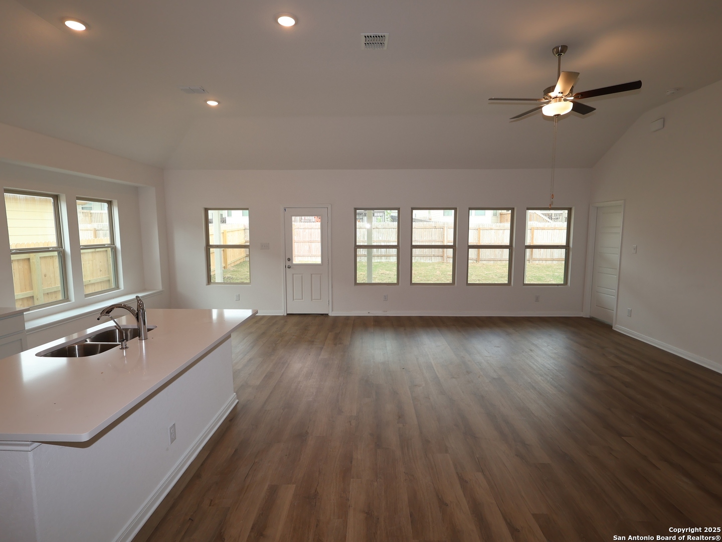 1164 Limestone Ridge Seguin, TX 78155 - Photo 3 of 45 a view of an empty room with wooden floor and a window